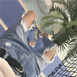 大腿破洞牛仔裤女图片